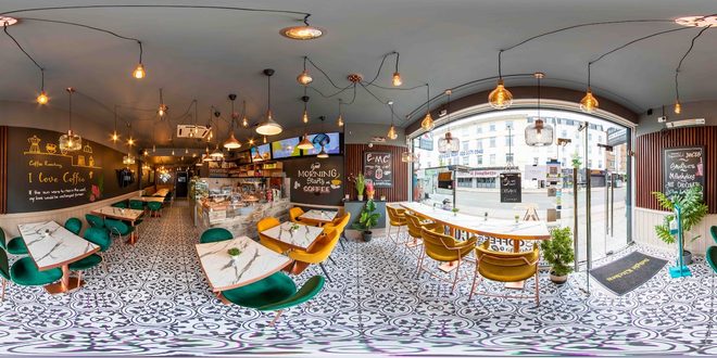 Wide view of the cafe room, counter and window onto Ballards Lane